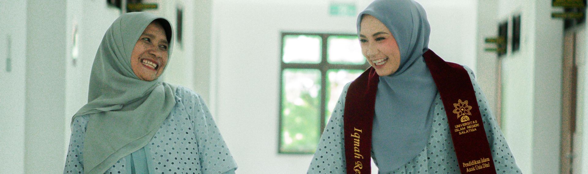 Woman in a cozy home setting working on a laptop for remote work and relaxation.