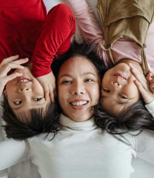 Caring moment between a senior man and a supportive woman at home, fostering connection and well-being.
